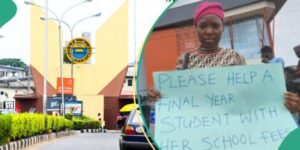 Read more about the article UNILAG Final Year Student Carries Placard on the Road, Begs for help to pay School Fees