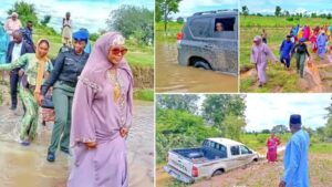 Read more about the article ‘Your husband didn’t fix the road’ – First lady spotted walking in mud water after convoy got spoilt (Photos)
